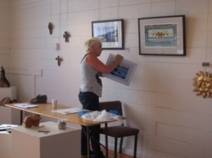 Curator Jean Carbon busy at work on the craft and arts exhibition