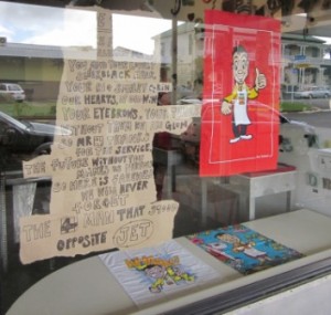 Poem dedicated to Mr Four Square in Jet Collective's window with other memorabilia