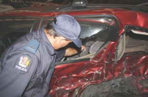 A serious crash unit investigator inspects the car seat that saved boy's life