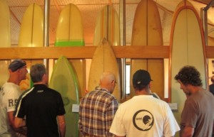 Discussing recollections of the surfbaords on display