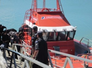 Navy divers load gear on Gallagher Rescue at Raglan Wharf