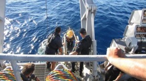 A Navy diver enters the water off the Waikato coast; image from CAA