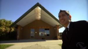 Ngaa Rauuira outside wharenui/meeting house at his school, Hastings, New Zealand - Imag