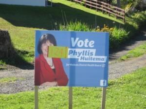 Sign for Phyllis Huitema has the smallest lettering and one line with letters too small to read