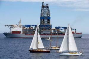 SV Vega confronts the Noble Bob Douglas drilling ship on the site where oil giant Anadarko intends to start exploratory drilling for deep sea oil. The drill site is over 100 nautical miles off Raglan, on the west coast of New Zealand, and in waters around a kilometre and a half deep. Greenpeace / Nigel Marple