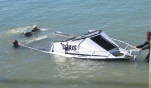 rescued boat being hauled out of the water. Image Sue Morrow