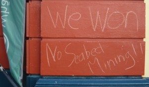 Chalked 'We Won' sign on Raglan Town Hall.  Or should it say the fish and the Maui  dolphin won!