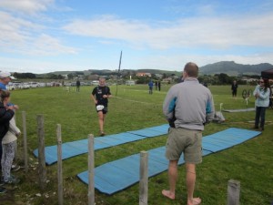 Runner 609 crosses the finish line