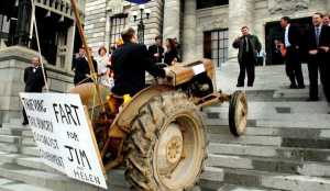 Taranaki-King Country MP Shane Arden drives tractor up steps of Parliament- scene from HOT AIR. Image supplied