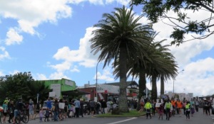 The march going round the palms outside the Raglan Town Hall