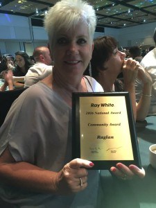 Julie Hanna after receiving the Community Award at the RayWhite conference for Raglan Real Estate's community commitment. Image FB