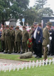 Laurie Coxhead from the Raglan RSA comes forward to lay a wreath