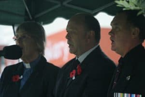 Ministers Kathleen Gavin and Sean Ellison with RSA President Saen O'Brien lead singing of a hymn