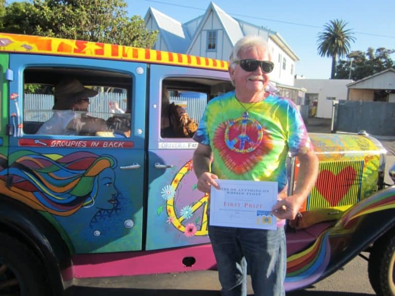 Peter Storey receives the 1st prize for Anything on Wheels in front of his entry - Hippie Happy Sunshine