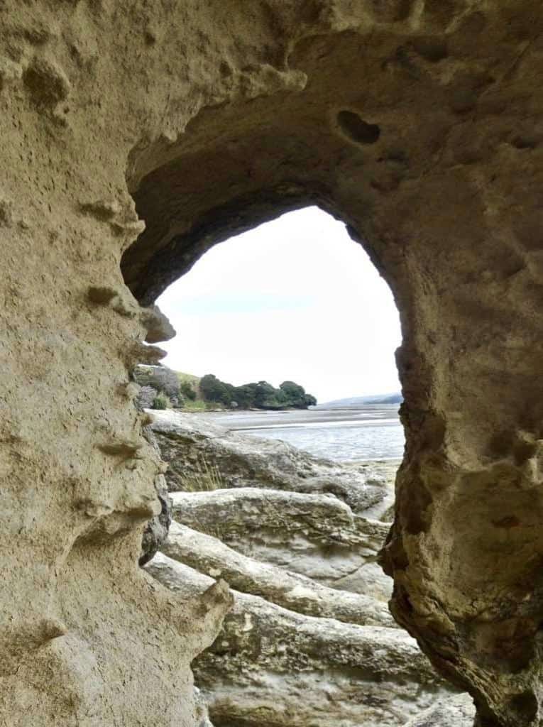 An arch - one of many rock formations on the Aotea harbour walk. Image John Lawson